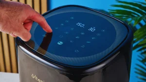 Air fryer in use with timer counting down how long to preheat air fryer.