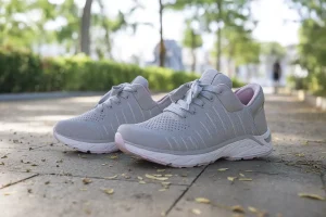 Light gray sneakers on walkway