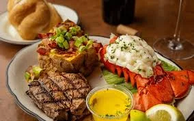 Best Steak Delivery steak and lobster dinner with baked potato