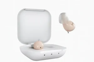 Audien Atom hearing aids with charging case on white background