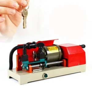 Compact key cutting machine with red safety cover 