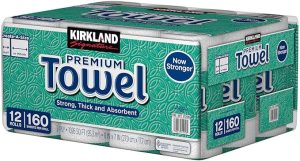 Kirkland Signature Premium Paper Towels 12-roll pack labeled strong, thick, and absorbent, showcasing one of the best paper towels for home cleaning and durability.